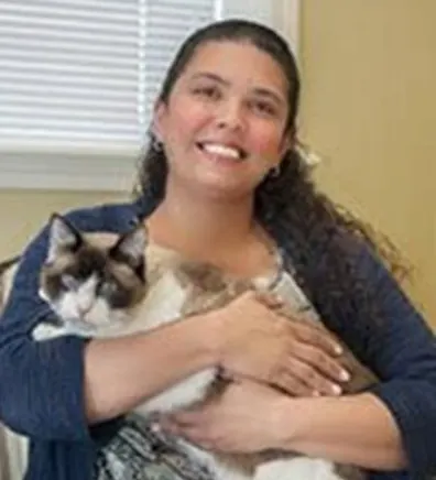 Michelle Falcon holding a cat at Tall City Veterinary Hospital